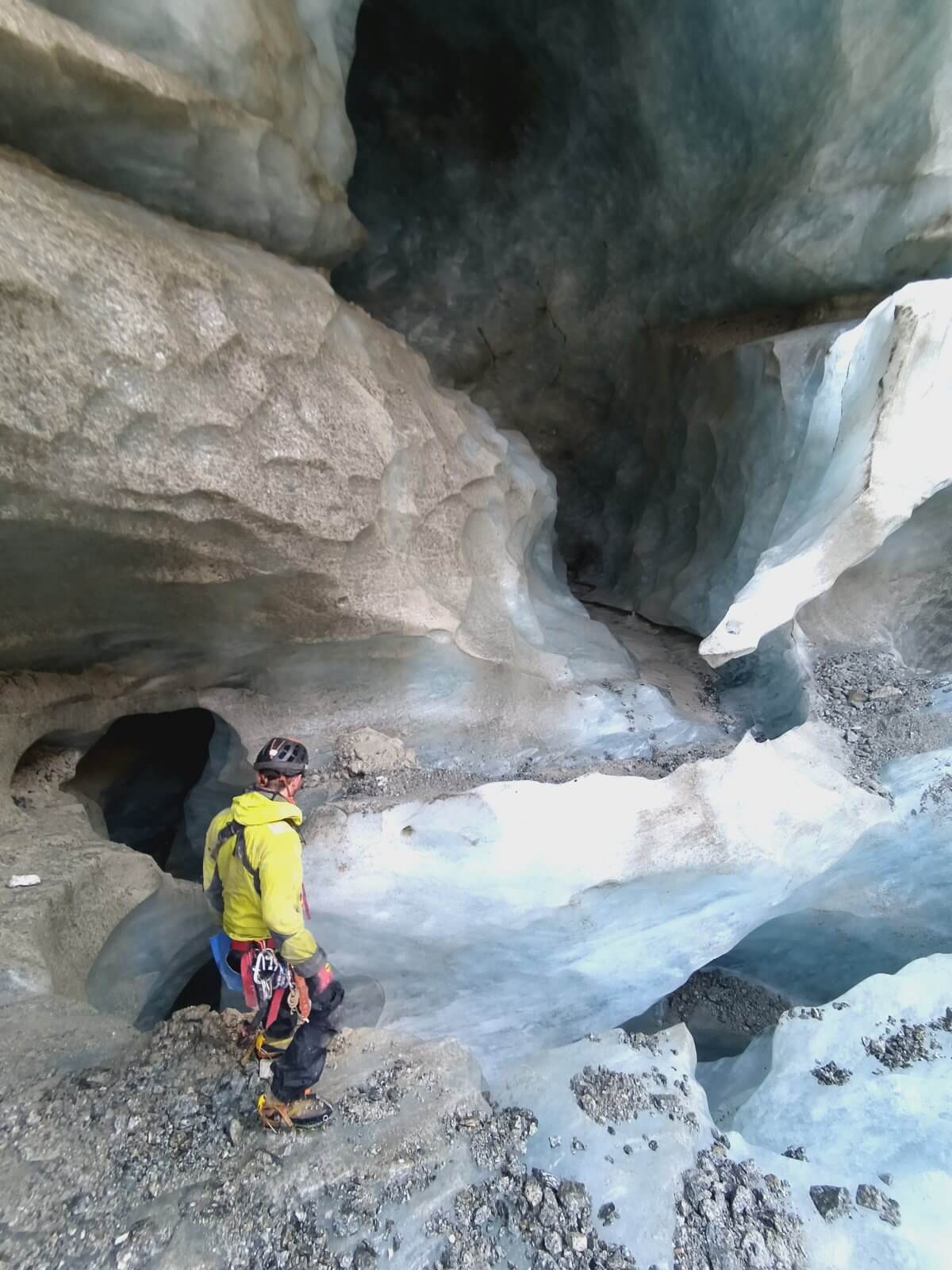 A teammate in an ice gallery of a Mer de Glace moulin